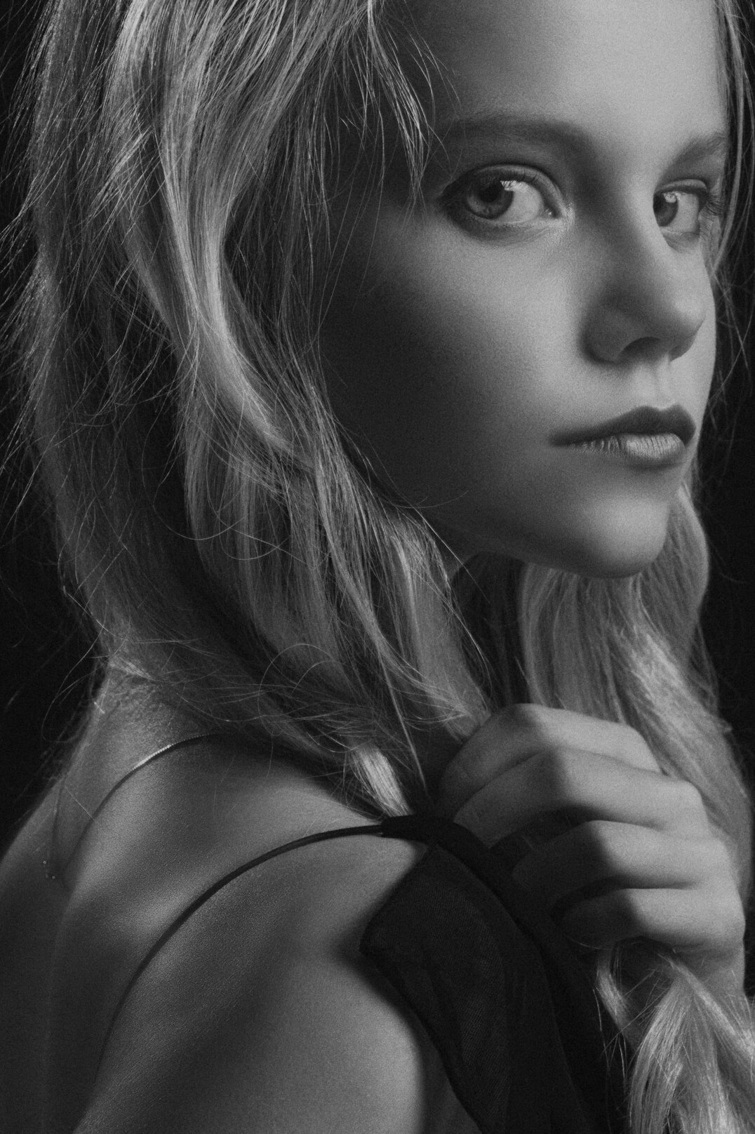 Studio portrait of a young woman with blonde hair