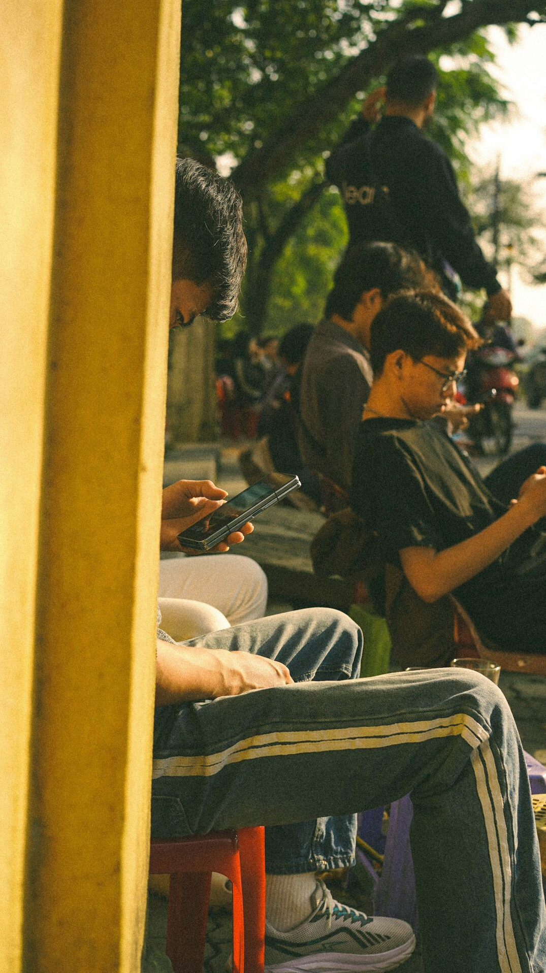 people using smartphones in public